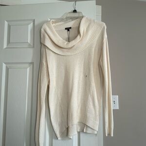 Off white sweater with nice neckline. Tags are still on it.